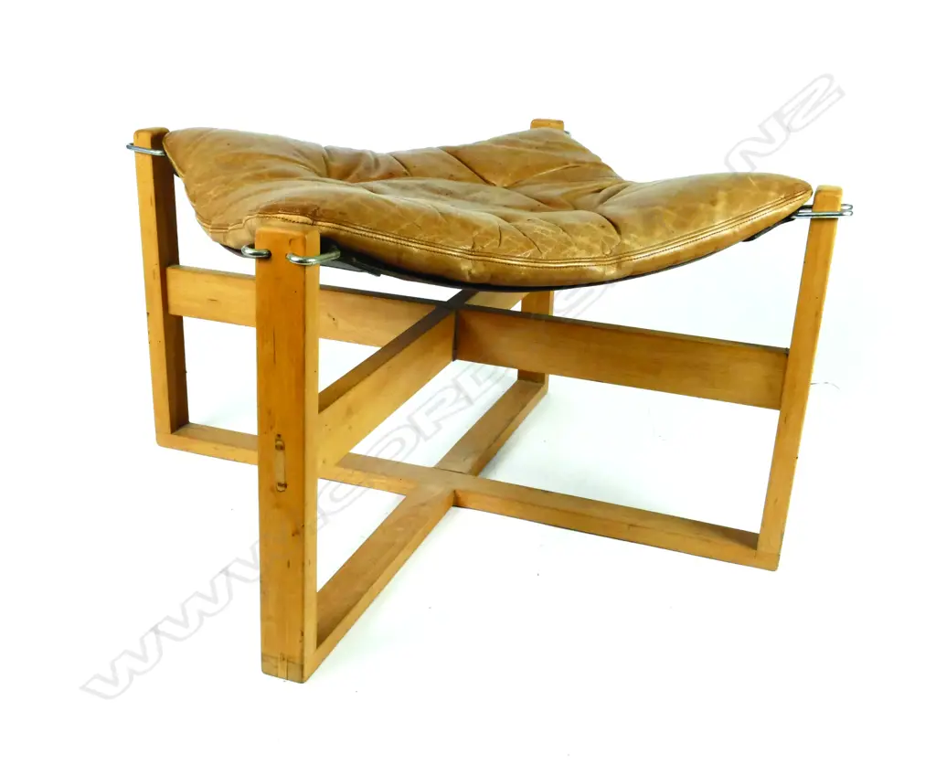 An ottoman using a Sigurd Ressell canvas sling and tan leather cushion Image 1++