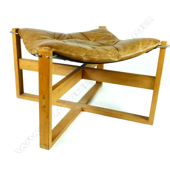 An ottoman using a Sigurd Ressell canvas sling and tan leather cushion