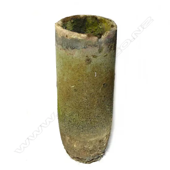 A large old furnace crucible