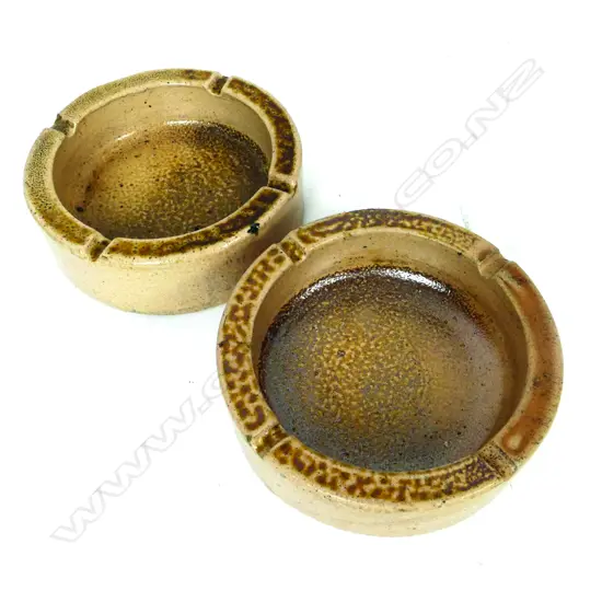 Two heavy pottery ashtrays