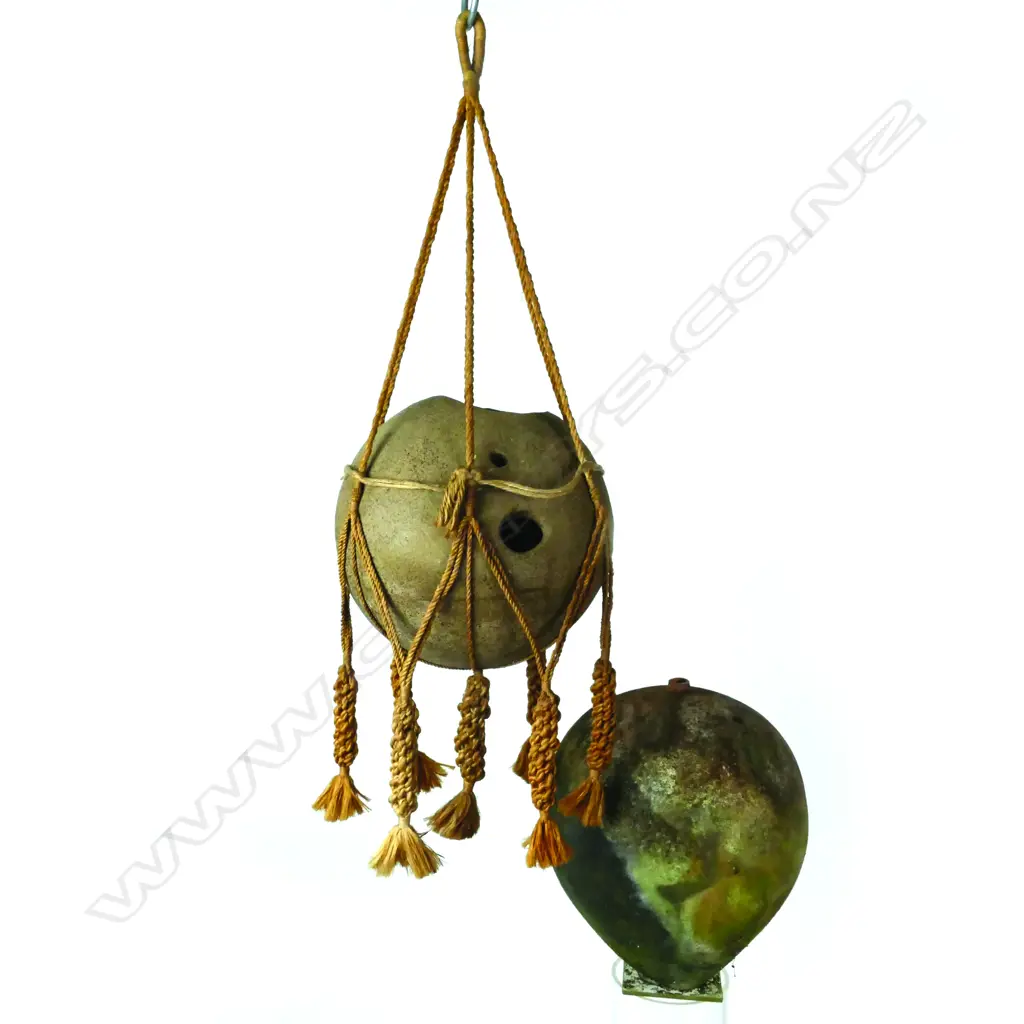 A pottery vase in macramé hanger Image 1++