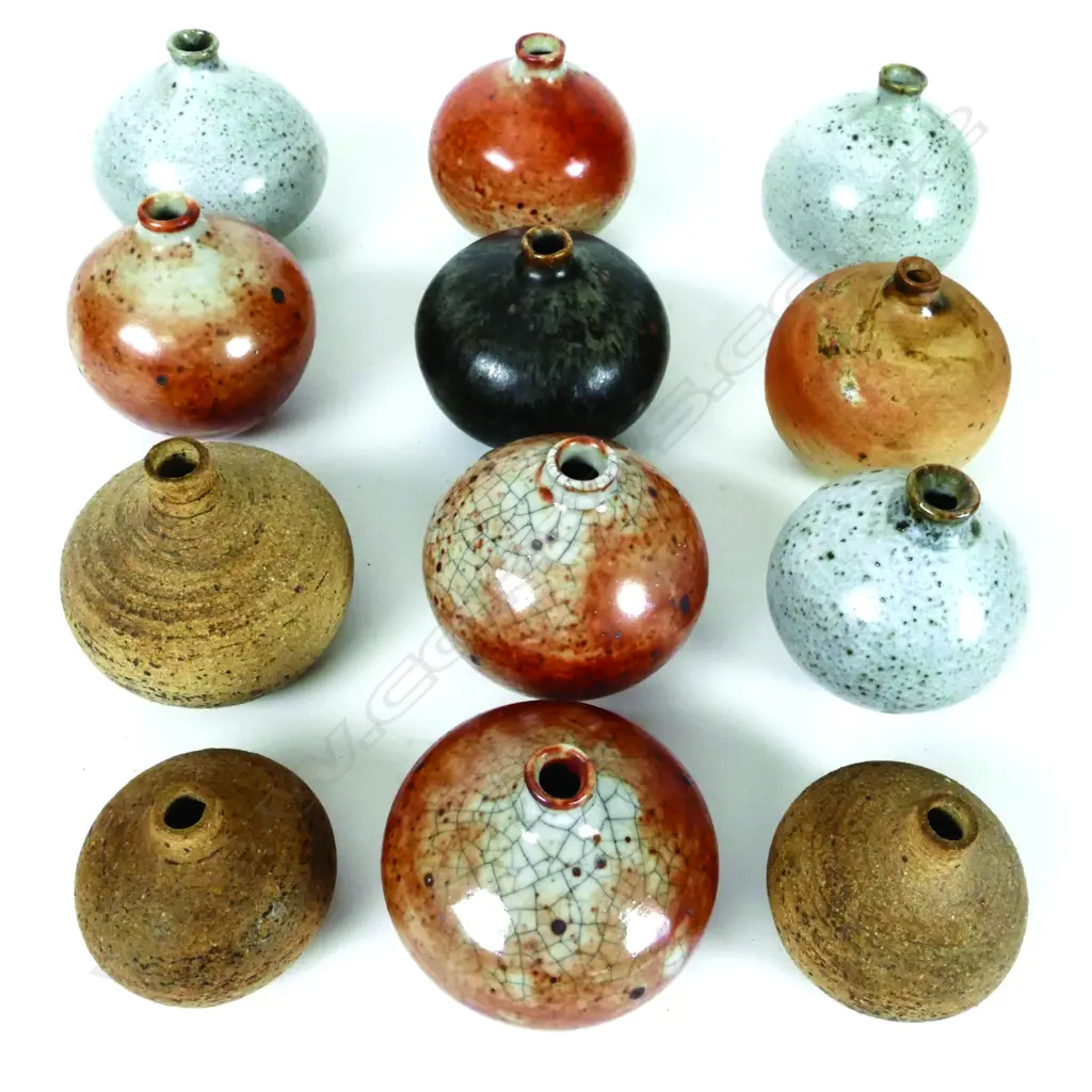 Twelve small pottery vases Image 1++