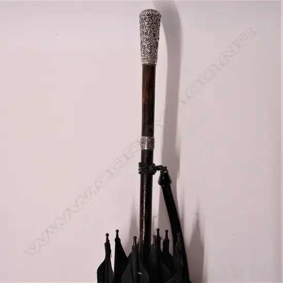 An early 20thC silver handled lady’s parasol