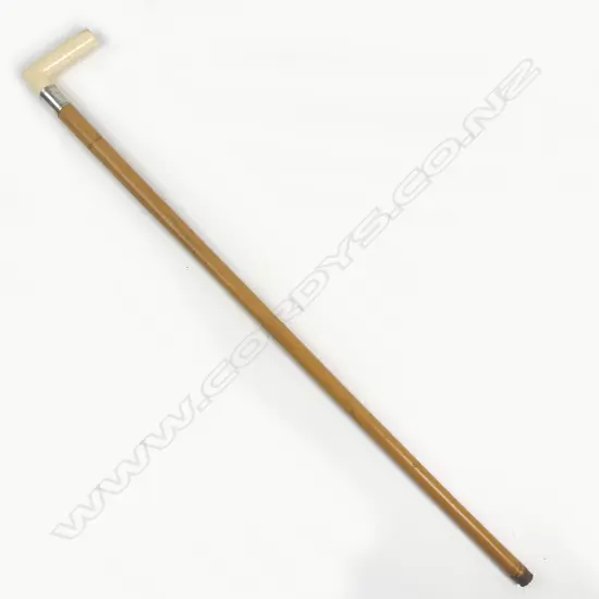 A vintage ivory handled walking stick