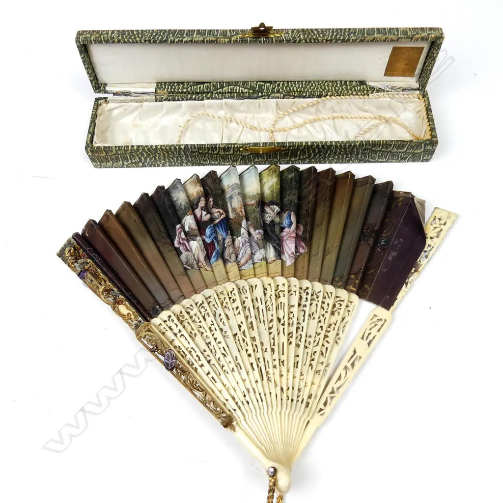 An early 20thC decorative carved bone and hand painted fan Image 1++