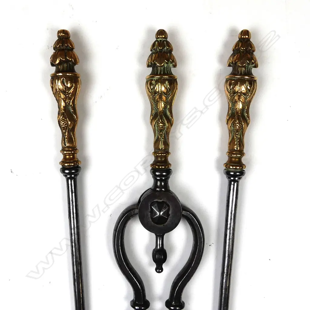A set of steel and cast copper fire irons Image 1++