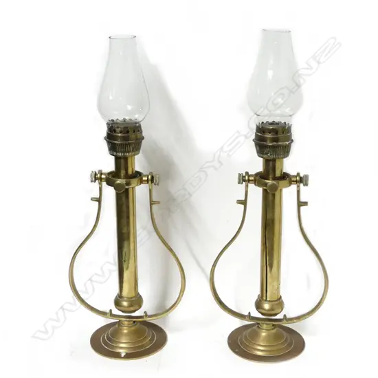 A pair brass ship's gimbaled candle lamps