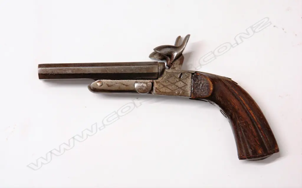 An antique .32cal double barrel pocket pistol Image 1++