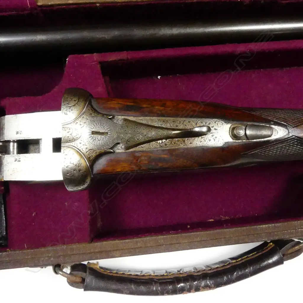 A Holloway & Naughton 12 gauge double barrel shotgun Image 1++