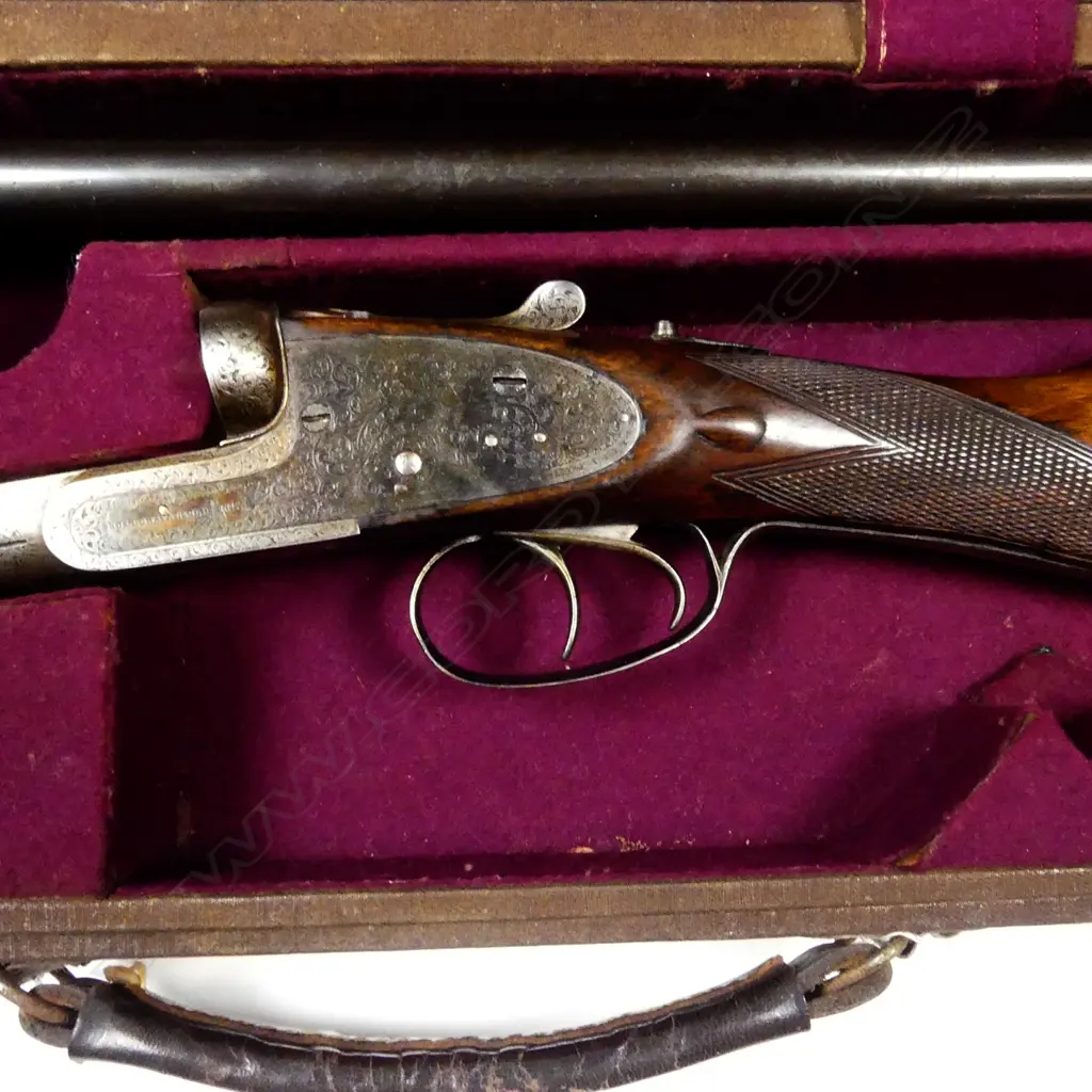 A Holloway & Naughton 12 gauge double barrel shotgun Image 1++