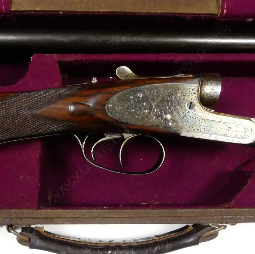 A Holloway & Naughton 12 gauge double barrel shotgun Image 1++