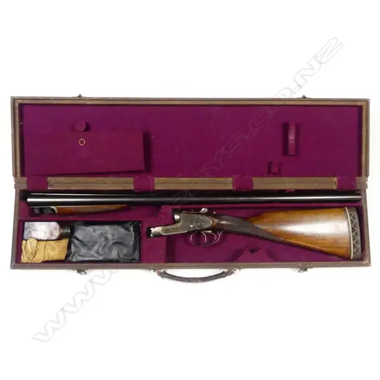 A Holloway & Naughton 12 gauge double barrel shotgun