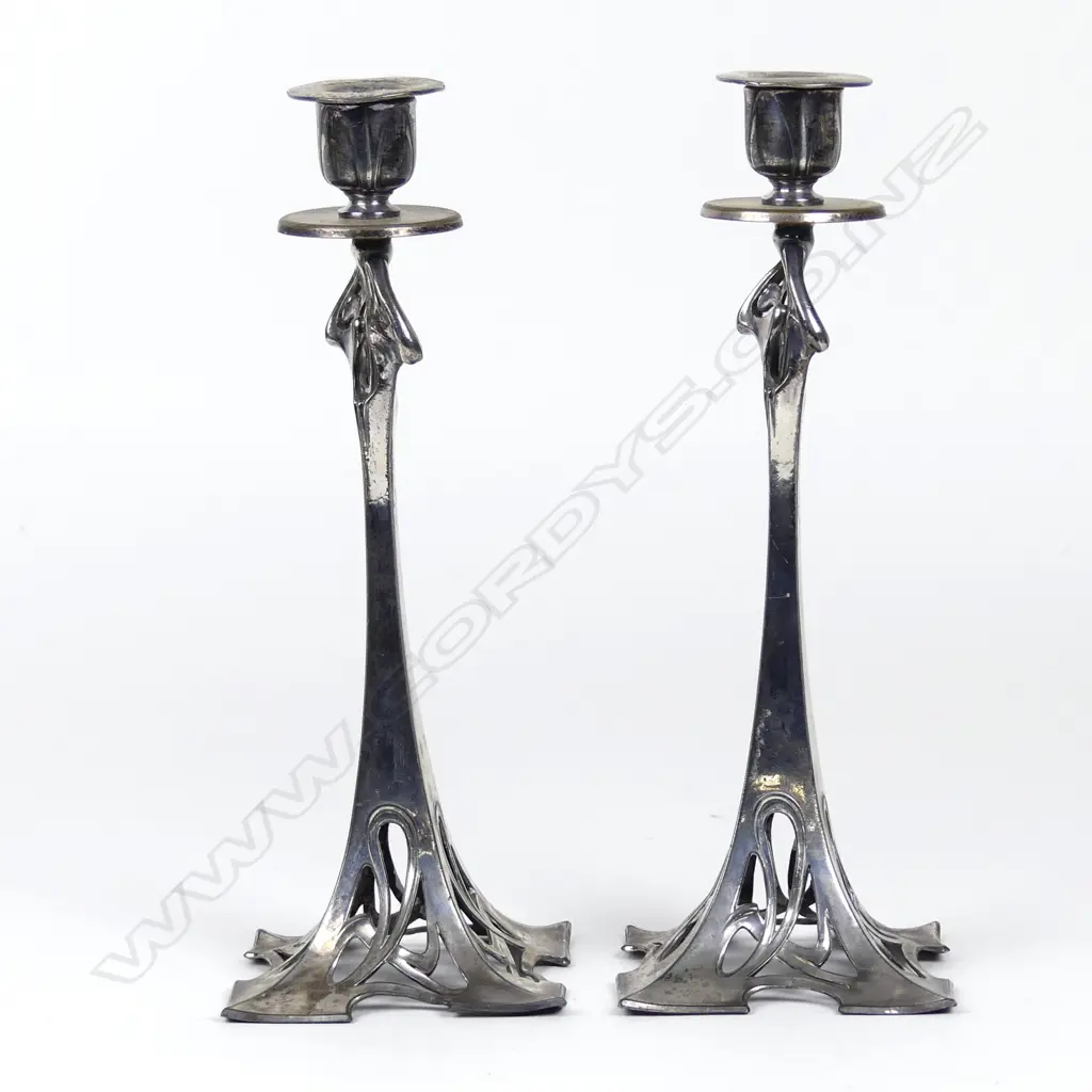 A pair of WMF silver plated candlesticks Image 1++