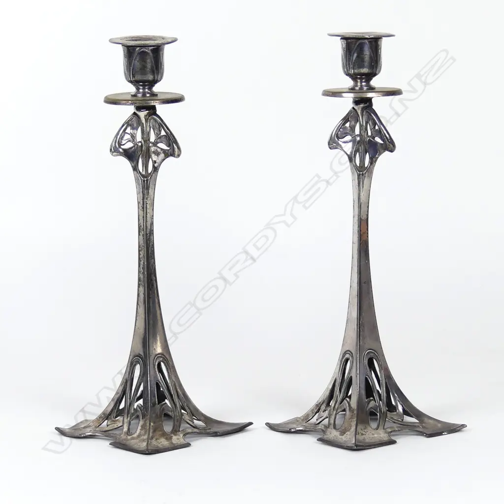A pair of WMF silver plated candlesticks Image 1++