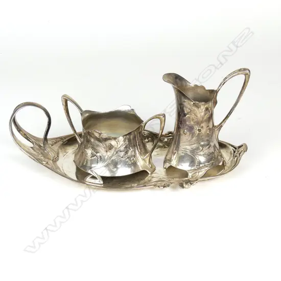 A WMF silver plated milk jug and sugar basin on stand