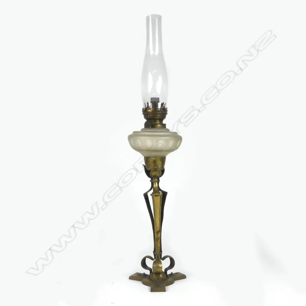 An Arts & Crafts brass kerosene lamp Image 1++