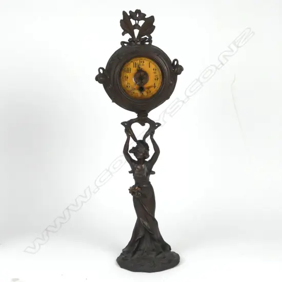An Art Nouveau spelter bronze figural based clock