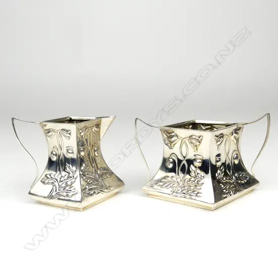 An Art Nouveau silver small creamer and sugar