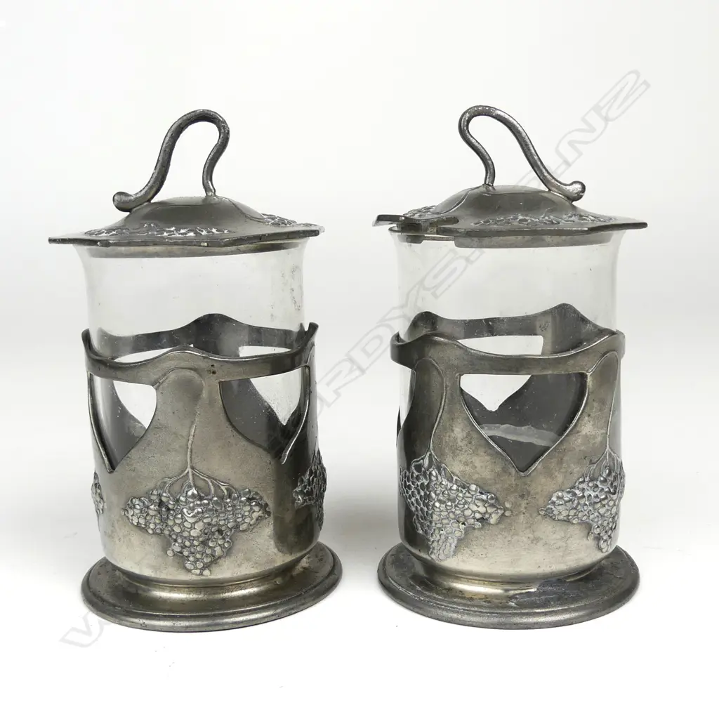 A pair of Orovit pewter and glass condiment pots Image 1++