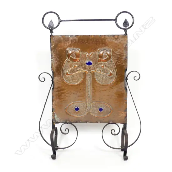 An Arts & Crafts wrought iron and copper fire screen