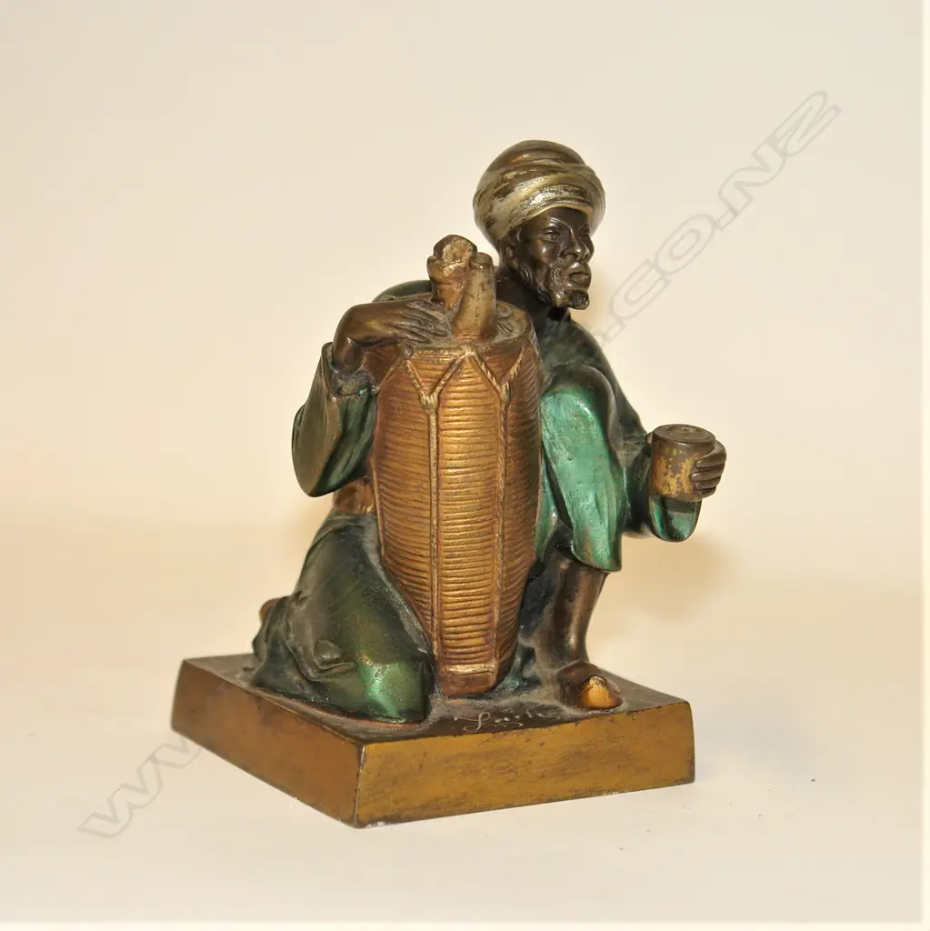 An Orientalist Art Deco cold painted bronze figure of an Arab water seller by Bruno Zach (1891 - 1935) Image 1++