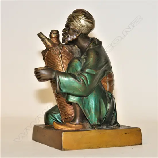 An Orientalist Art Deco cold painted bronze figure of an Arab water seller by Bruno Zach (1891 - 1935)