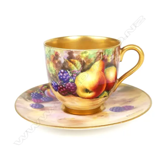 A Royal Worcester miniature cabinet cup and saucer