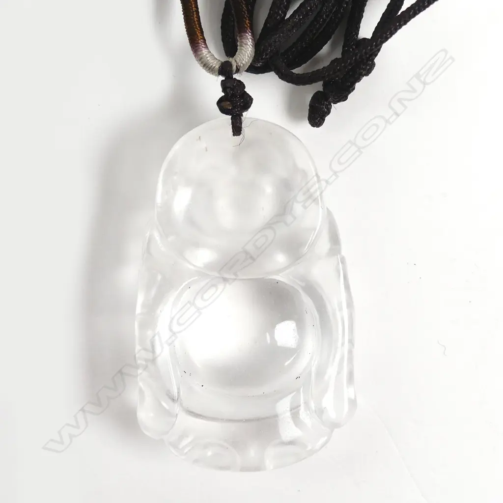 A Chinese carved rock crystal Buddha figured pendant Image 1++