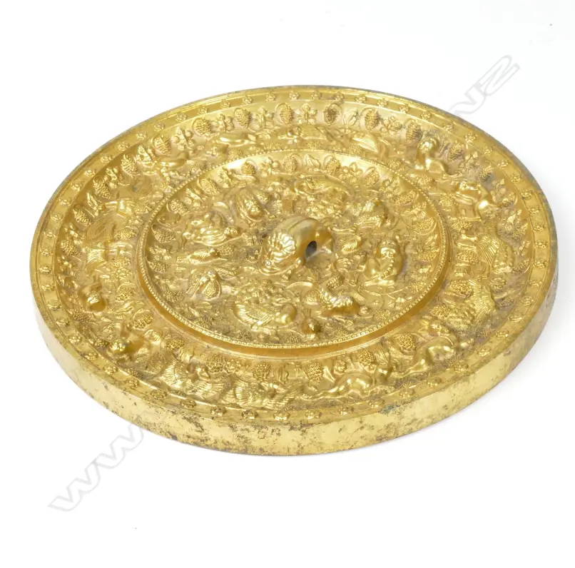 A highly ornate gilded Oriental bronze circular mirror Image 1++