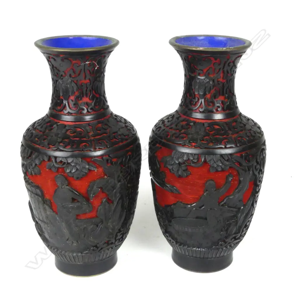 A pair of carved black lacquer over cinnabar vases Image 1++