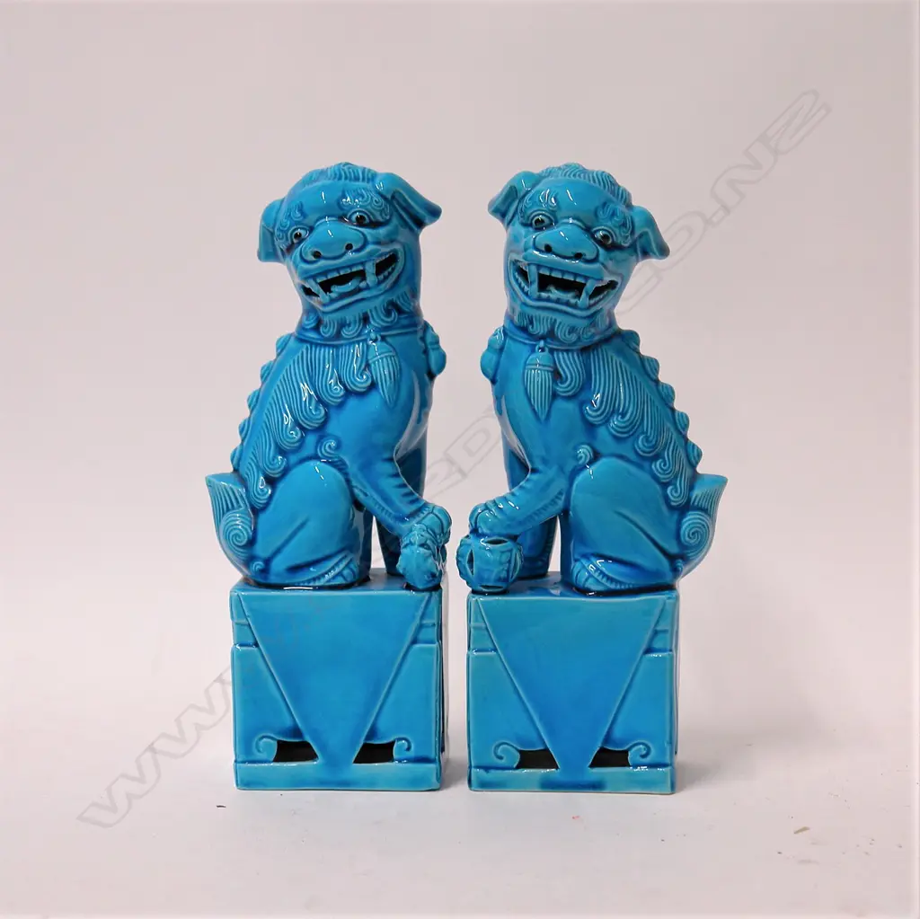 A pair of Chinese turquoise glazed foo dogs Image 1++