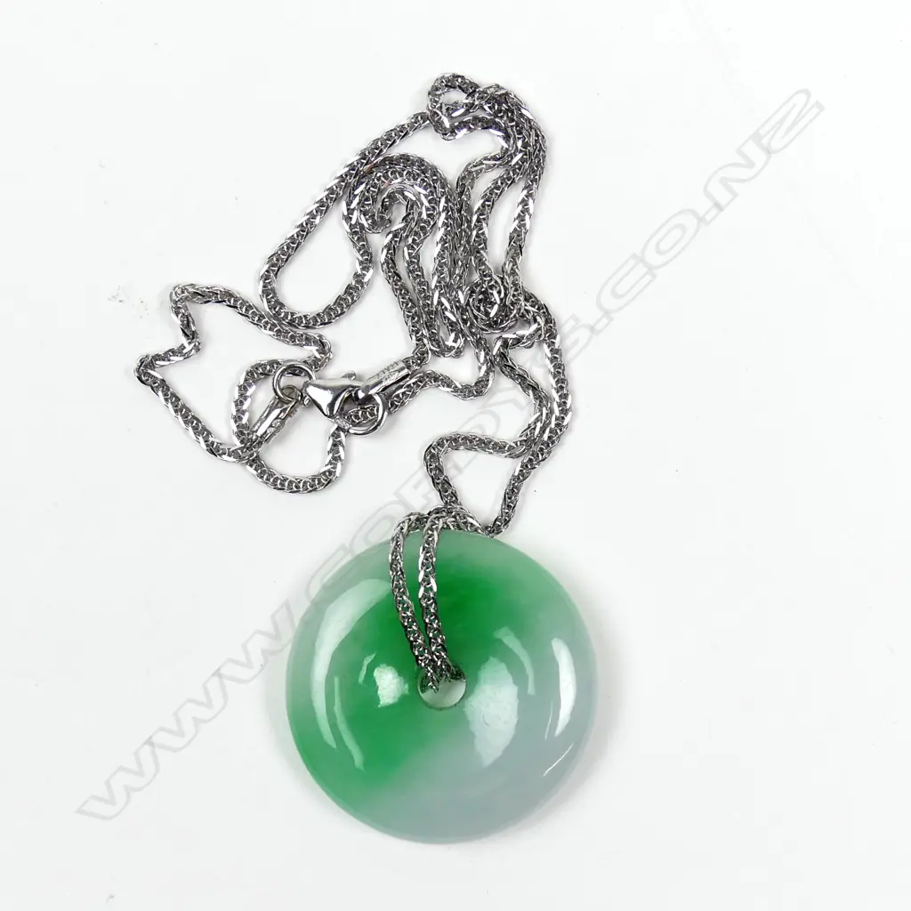 A variegated jade pendant Image 1++