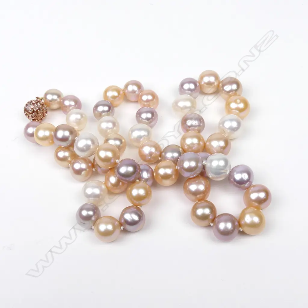 A 14ct rose gold pearl and diamond necklace Image 1++