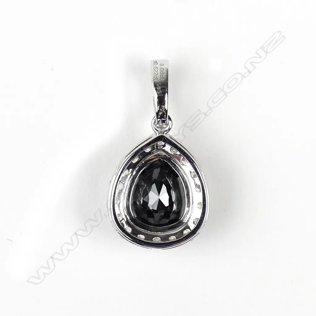 A 14ct white gold and diamond pendant Image 1++