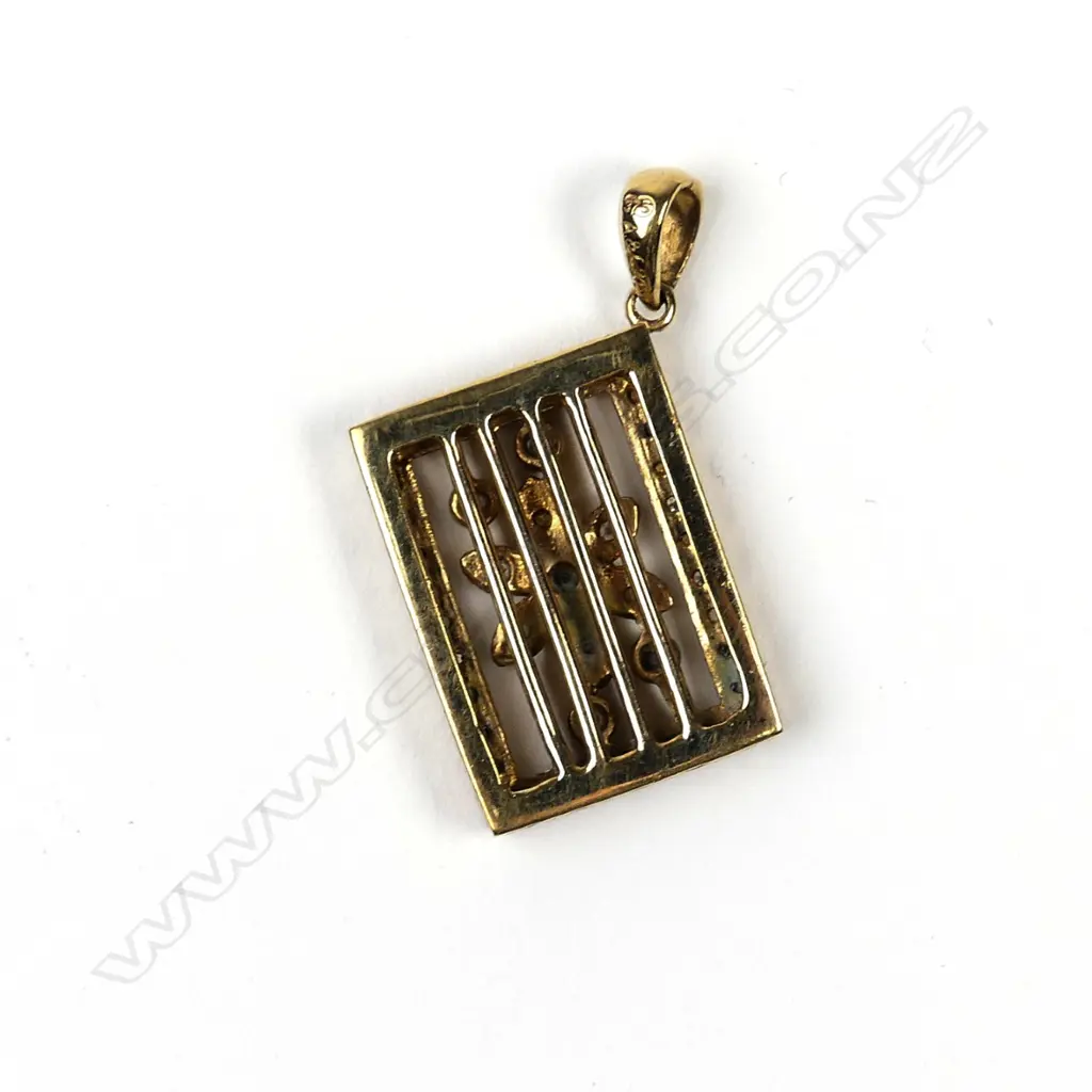 A 9ct gold and diamond pendant Image 1++