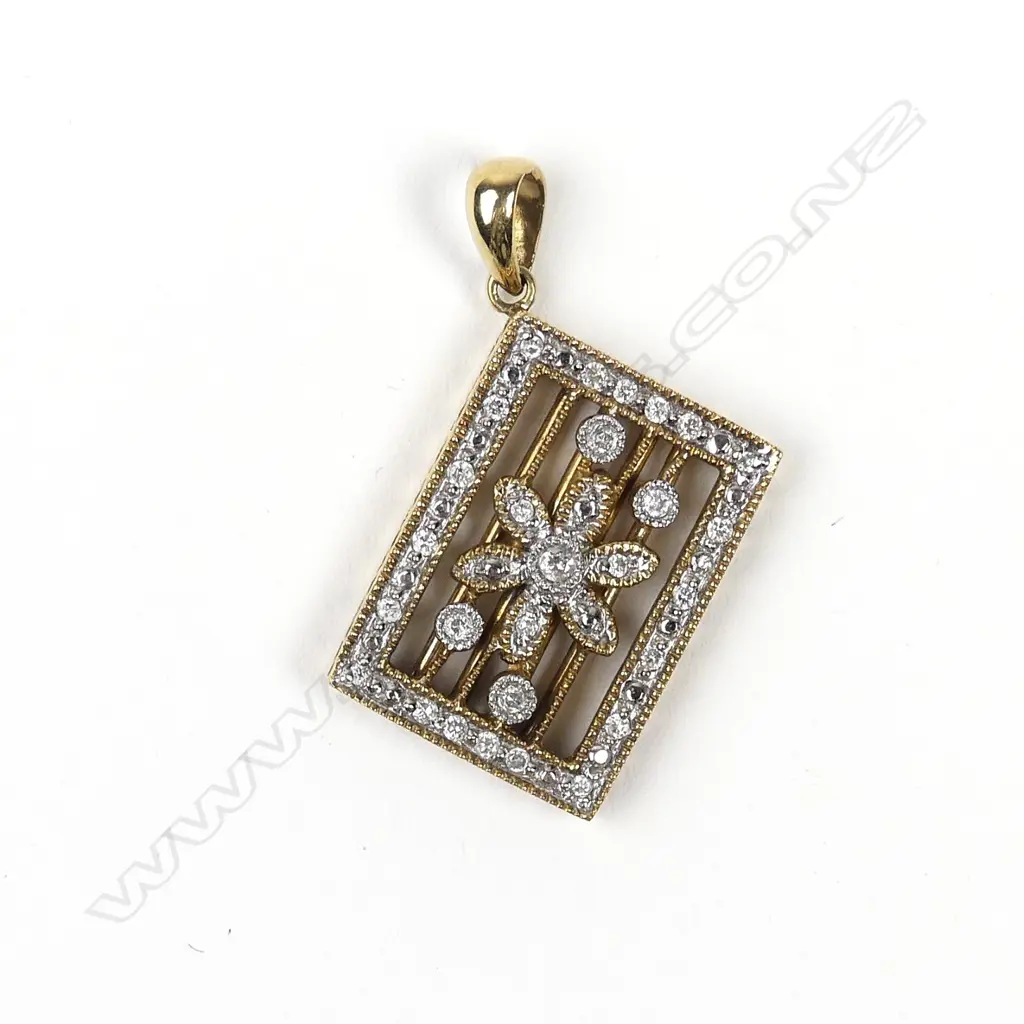 A 9ct gold and diamond pendant Image 1++