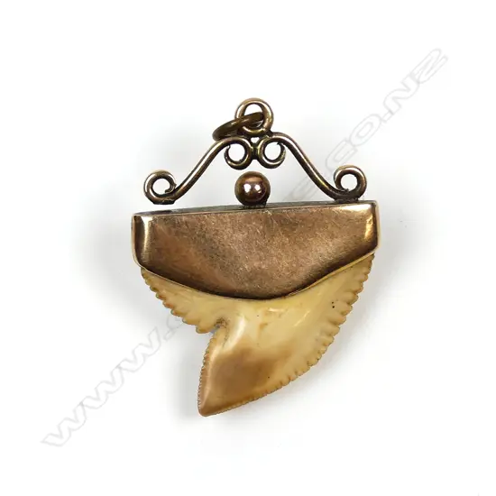 A 9ct rose gold and shark tooth pendant