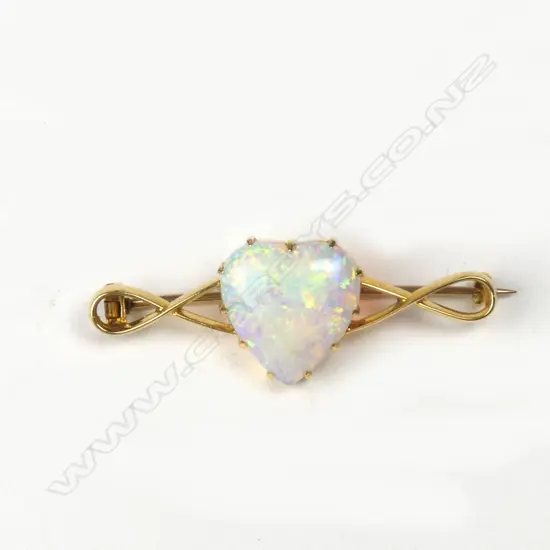 An Edwardian 18ct. yellow gold and large opal brooch