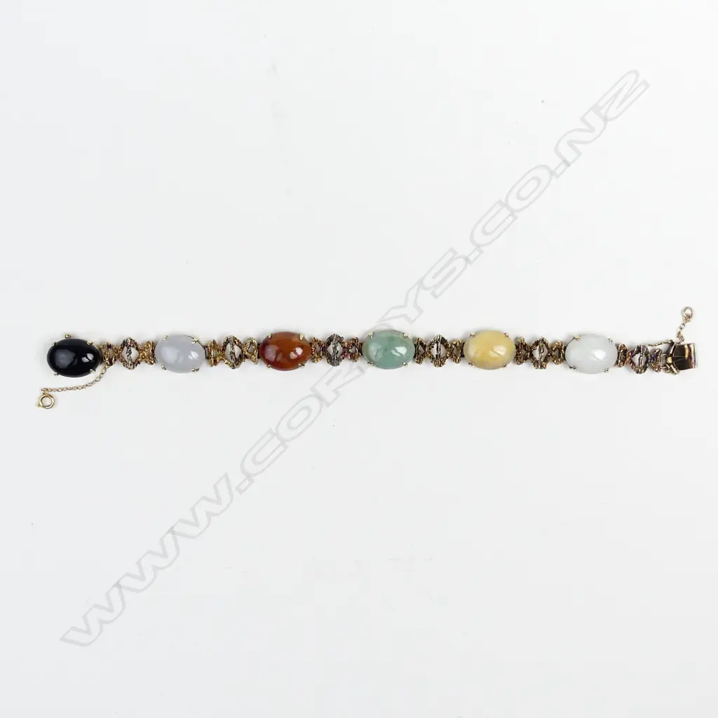 A stylish vintage 14ct. yellow gold and variously coloured jade cabochon bracelet Image 1++