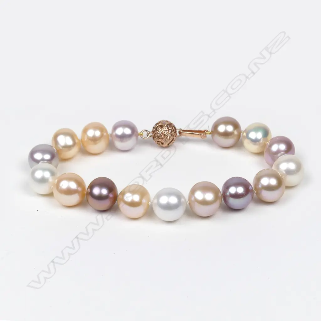 A 14ct rose gold pearl and diamond bracelet Image 1++