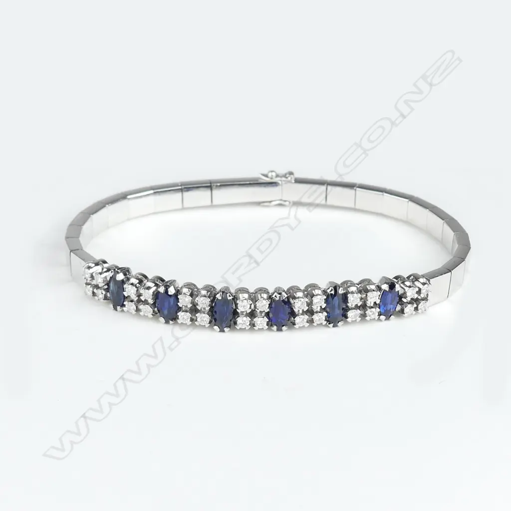 An 18ct white gold diamond and sapphire bracelet Image 1++