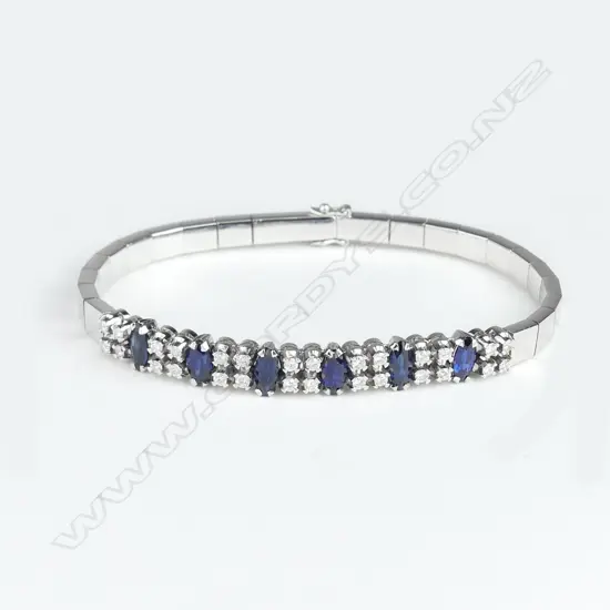 An 18ct white gold diamond and sapphire bracelet