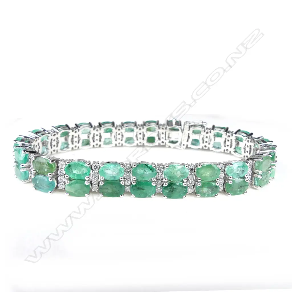 A 14ct white gold emerald and diamond bracelet Image 1++