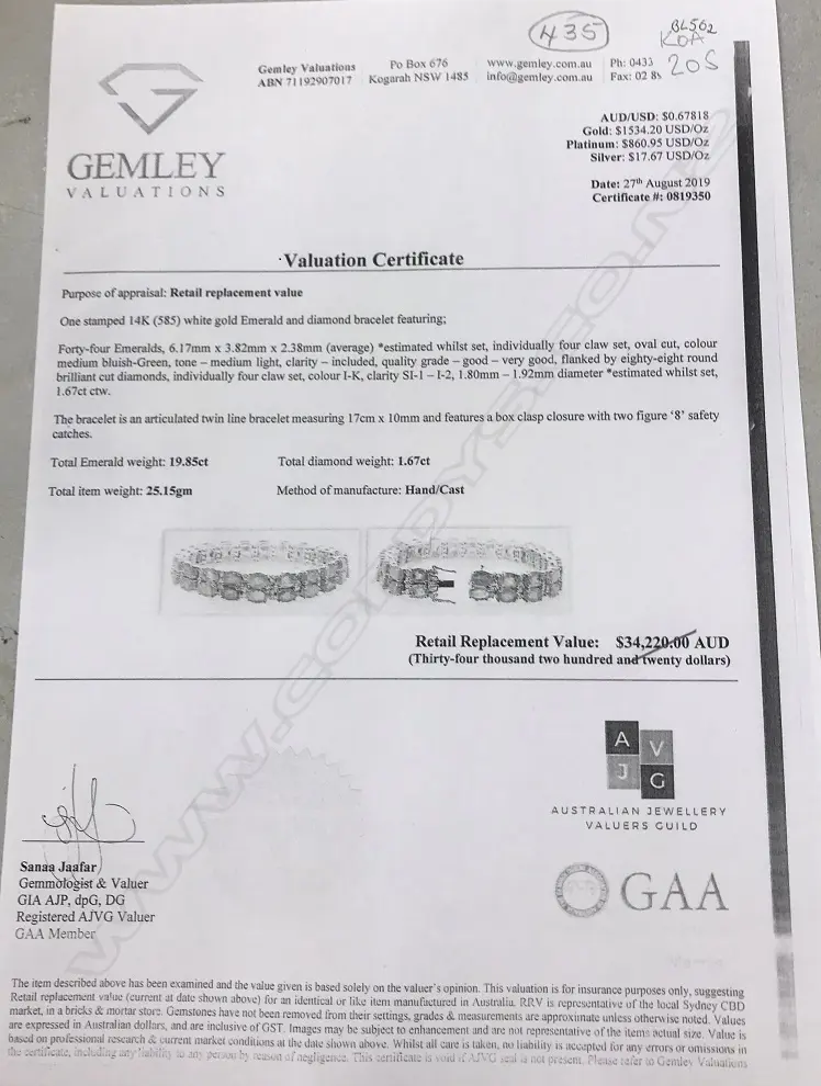 A 14ct white gold emerald and diamond bracelet Image 1++