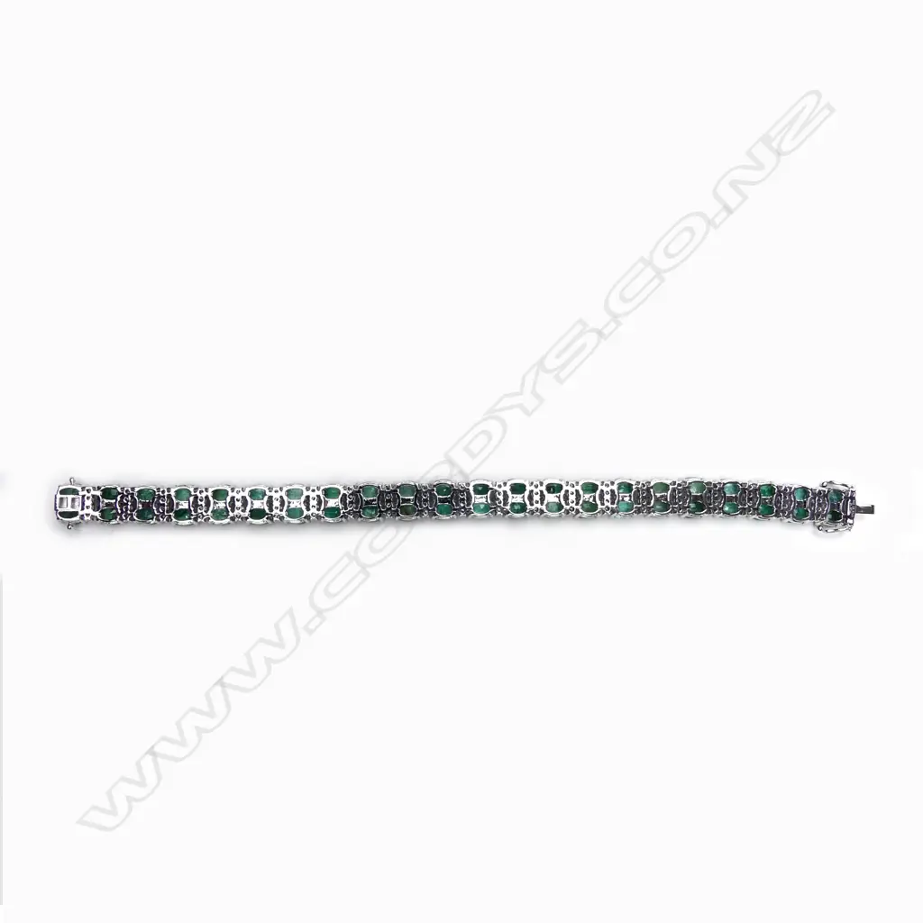 A 14ct white gold emerald and diamond bracelet Image 1++