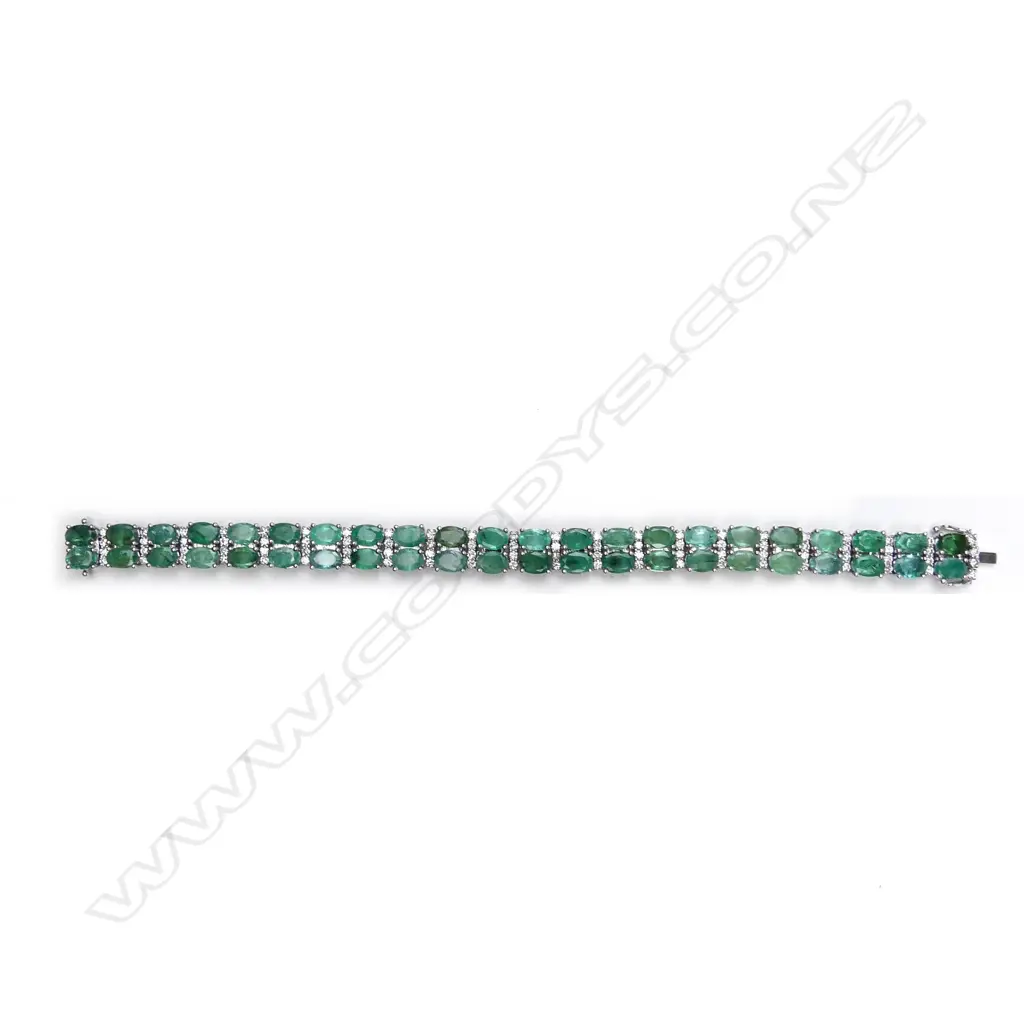 A 14ct white gold emerald and diamond bracelet Image 1++