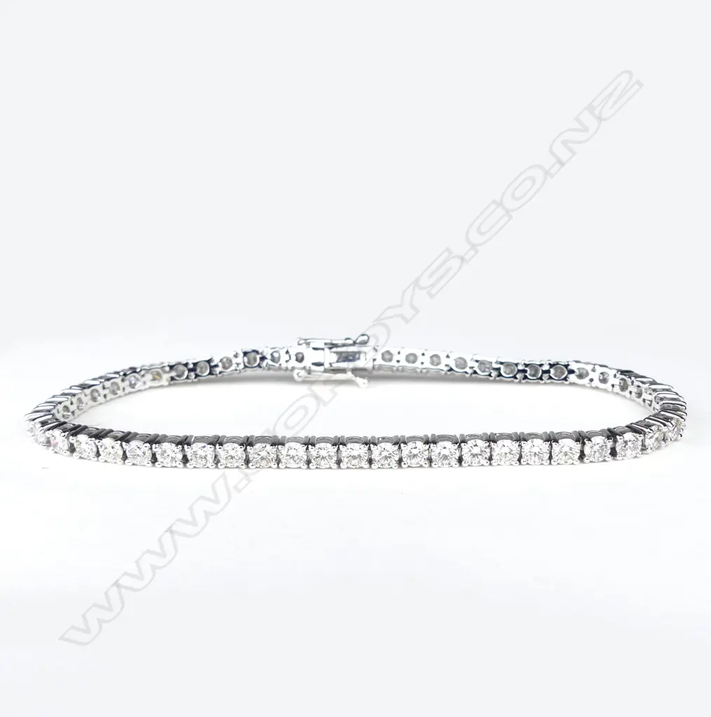 A 14ct white gold and diamond tennis bracelet Image 1++