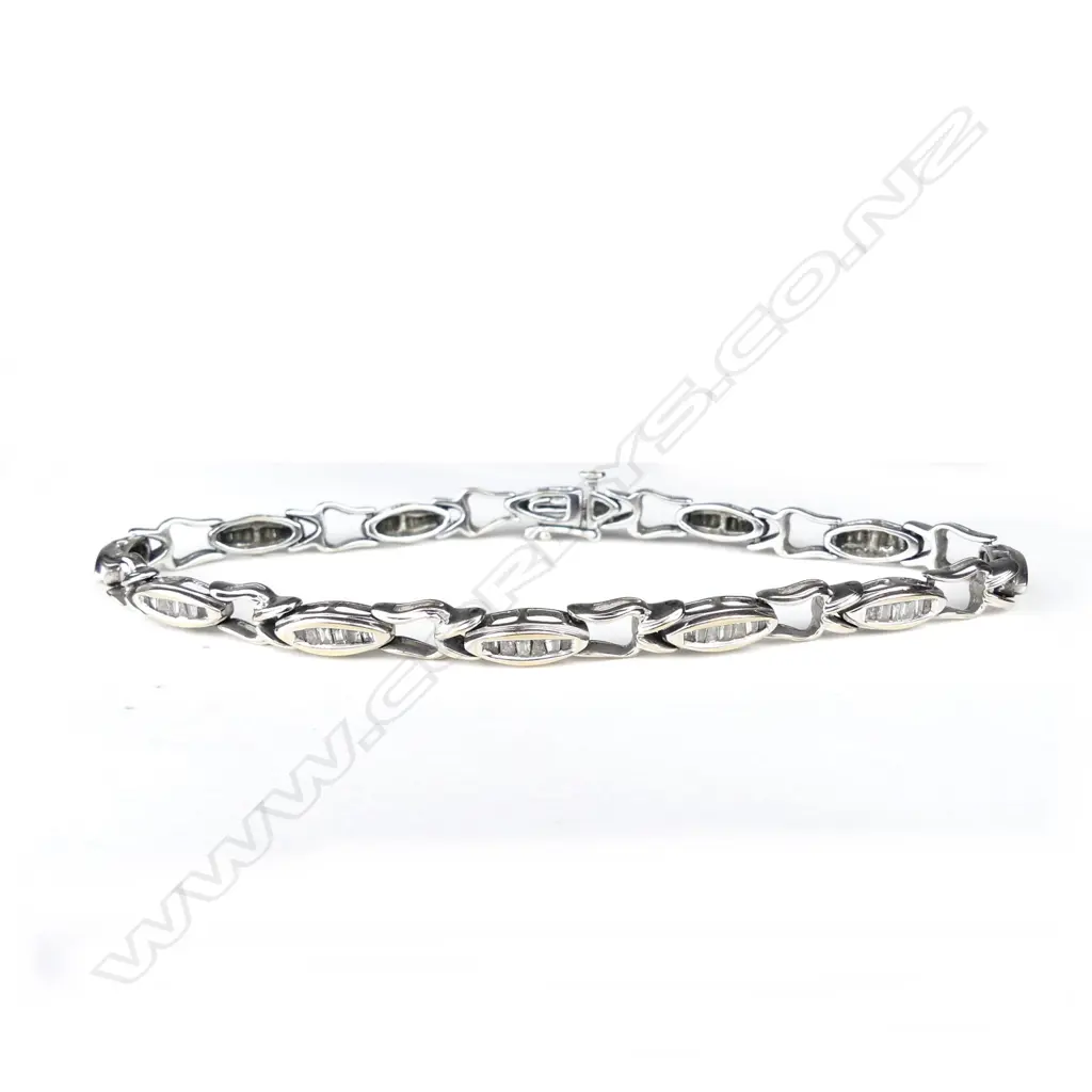 An 18ct white gold and diamond tennis bracelet Image 1++