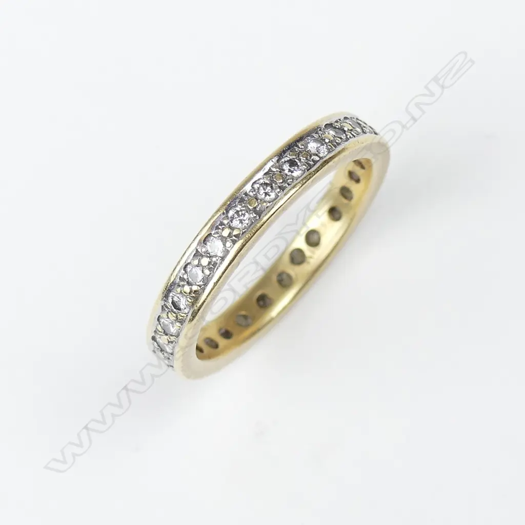 An 18ct gold and diamond eternity ring Image 1++