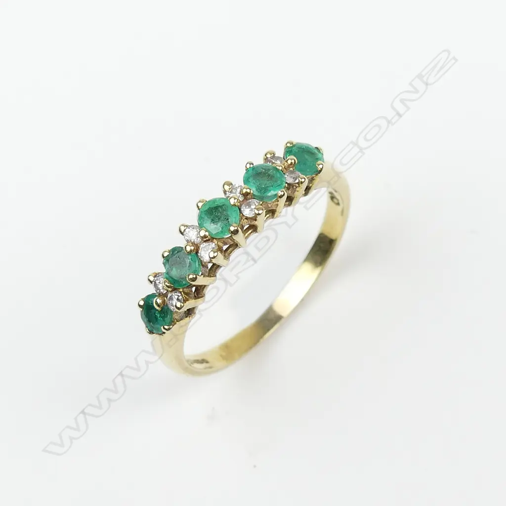 An 18ct gold emerald and diamond ring Image 1++